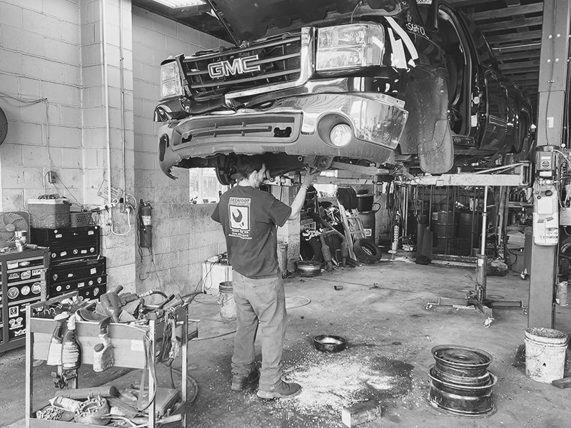 Darren dismantling a vehicle to be inventoried.